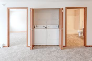 A laundry room with a washer and dryer